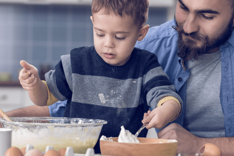 Child leading a cooking and baking session during toy/hobby play at Kids First Children’s Services.