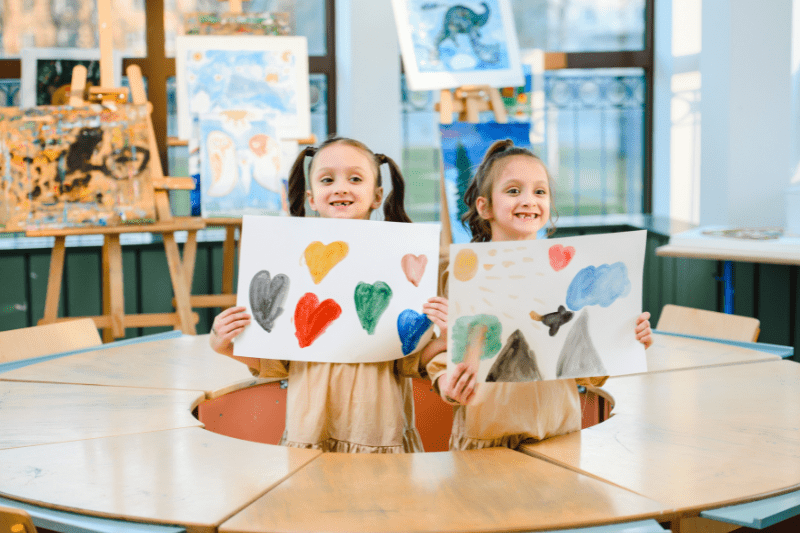 Child with Early Intervention support gaining confidence to participate in a classroom activity