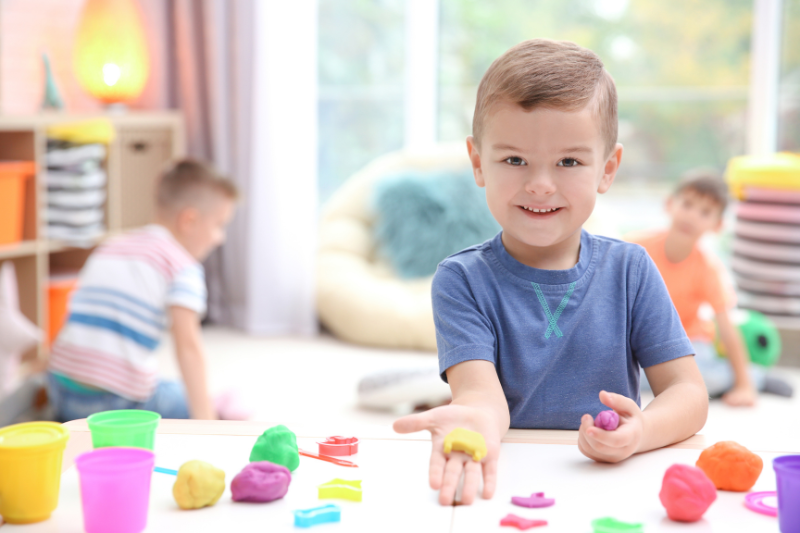 Occupational therapist using sensory toys with child