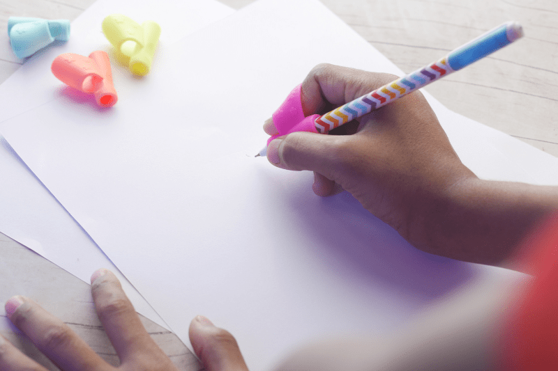 Child practicing pencil grip and handwriting