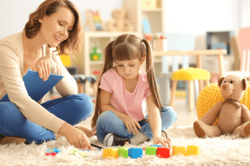 Child psychologist conducting a play-based autism assessment with a young child in Sydney's northern beaches.