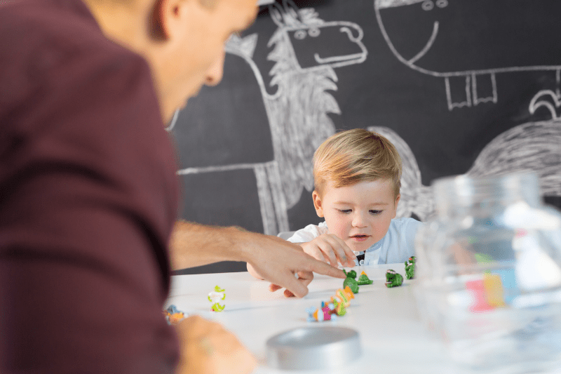 Child using colourful toys during a speech therapy session at Kids First Children’s Services.