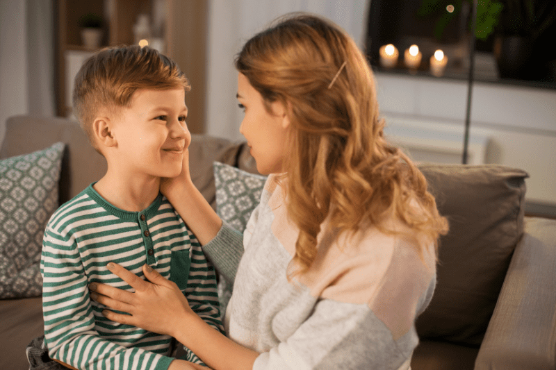 A parent praising their child for speaking respectfully to manage talking back.