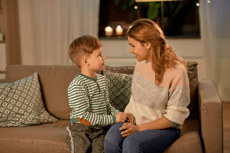 A parent calmly walking away from a child who is talking back, showing natural consequences.