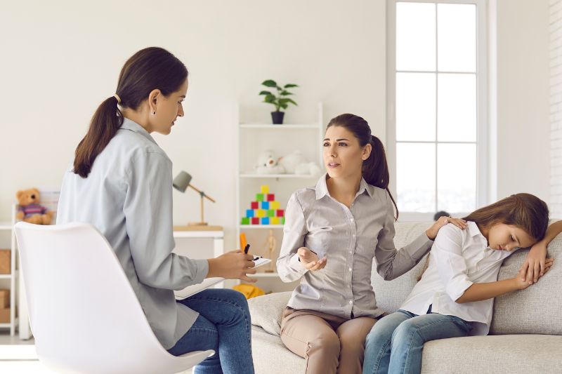 Parent-teacher meeting discussing practical ideas for at-home language development in Sydney's northern beaches.