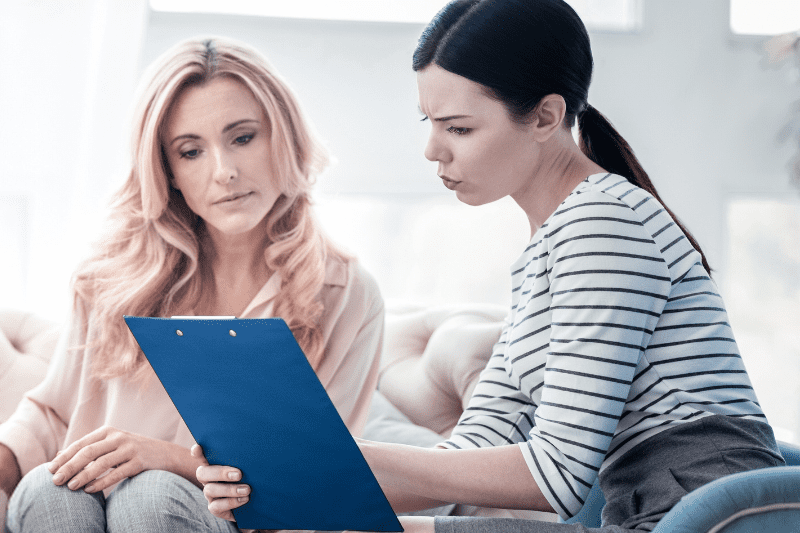 Child psychologist discussing autism assessment results with a parent in Sydney's northern beaches