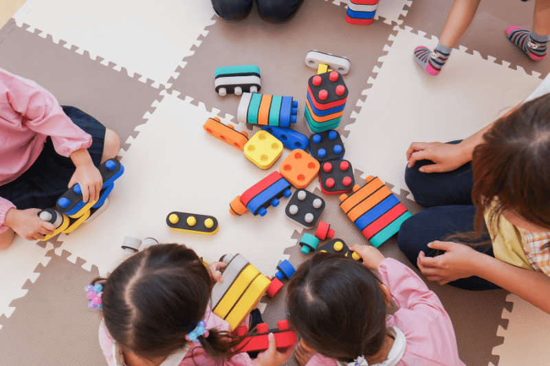 Children working together to resolve conflict in Brookvale with child psychologist support