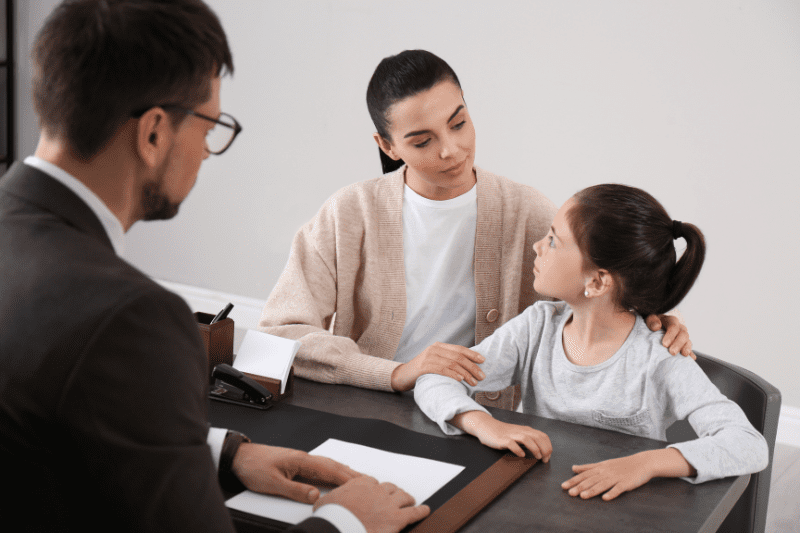 Parent and educator discussing a child's experience with bullying in Northern Beaches, Sydney, illustrating collaboration to support the child.