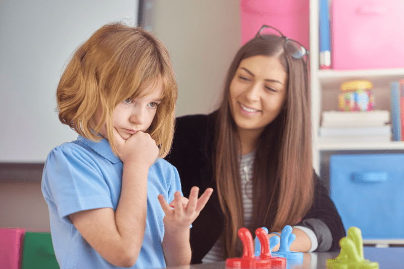 Early Intervention Specialist providing one-on-one support to a child at Kids First Children's Services, enhancing early childhood development and NDIS preschool participation.