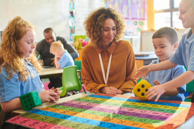 A preschool classroom setting at where an Early Intervention Specialist from Kids First Children's Services supports children to participate with confidence