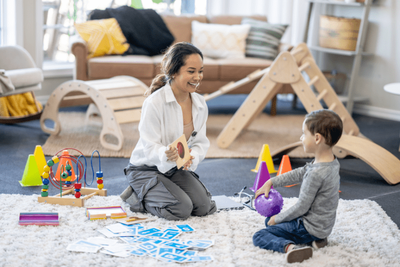 Speech pathologist conducting a play-based initial assessment for a young child in Northern Beaches, Sydney, to understand communication challenges.