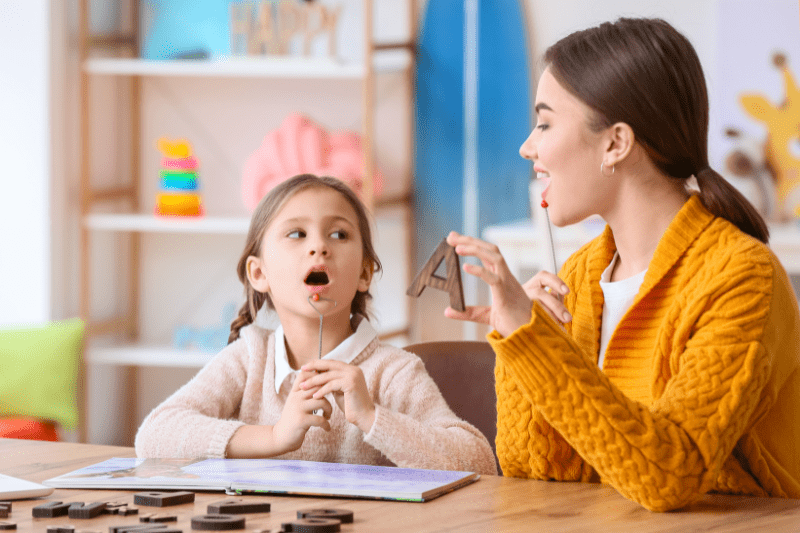 Child participating in speech therapy with a speech pathologist in Northern Beaches, Sydney, learning about communication and language development.