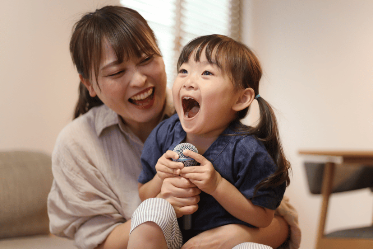 Parent and child accessing NDIS-funded supports during a speech therapy session at Kids First Children’s Services.