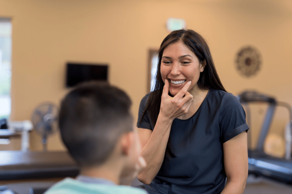 Child receiving play-based speech therapy for developmental delays at Kids First Children’s Services, highlighting tailored NDIS supports. Language Development Issues, Child Behavior Signs
