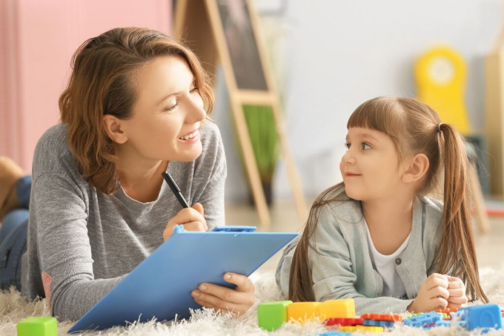 A child psychologist conducting an ADHD assessment with a school-aged child.