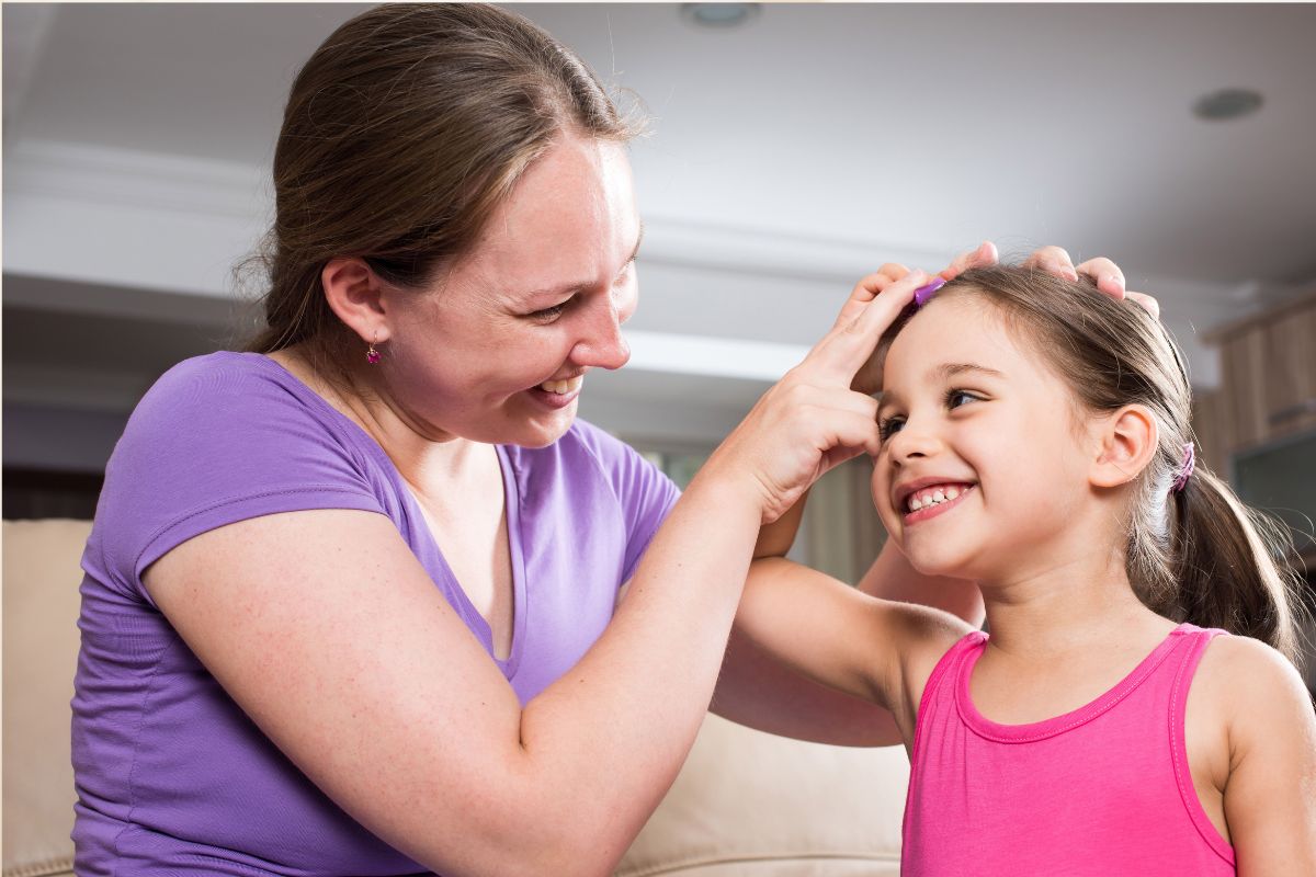 An autistic child with her mother at Kids First Children’s Services in Brookvale, representing the real-world impact of the Thriving Kids and No Child Left Behind policy discussions on children, families, and access to local multidisciplinary support.